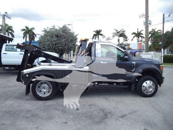 2017 Ford F450 tow truck with bed and wheel lift, side view showing cab and chassis, stock number overlay watermark.