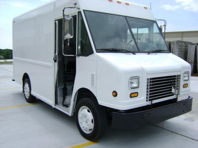 2007 Freightliner MT45 step van showing front grille, side entry door open, and cargo body in white.