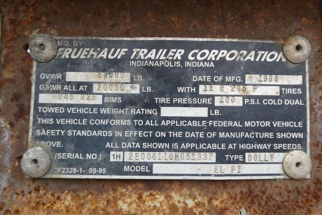 Plate on Fruehauf trailer with data: MFD BY FRUEHAUF TRAILER CORPORATION INDIANAPOLIS INDIANA. GVWR 20000 LB, GAWR ALL AT 20000 LB, TOWED VEHICLE WEIGHT RATING 0 LB? MODEL EL FI, SERIAL NO. 1H2E00611GH051337, DOLLY
