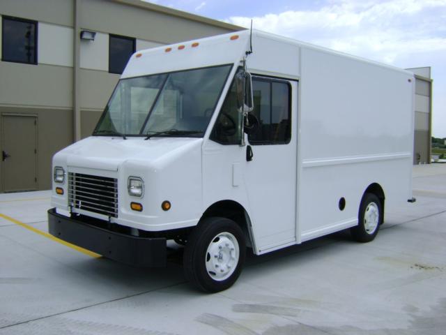 Box-style white Freightliner MT45 step van with large front windshield and black bumper, cargo box in back, no visible decals or branding.