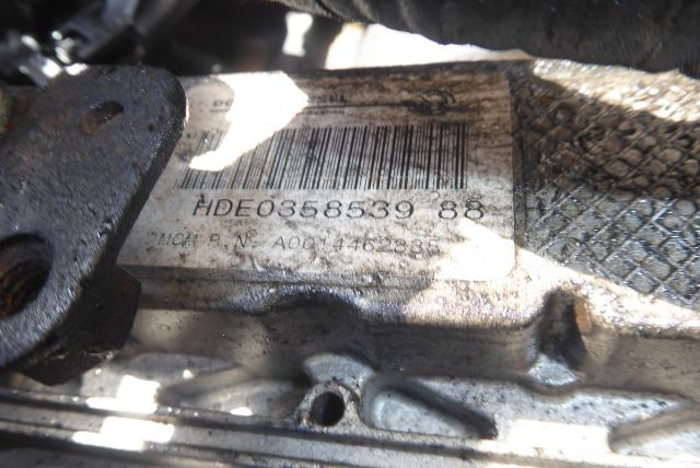 Label on Detroit DD13 engine core showing barcode and part number HDE0358539 88 and serial numbers.