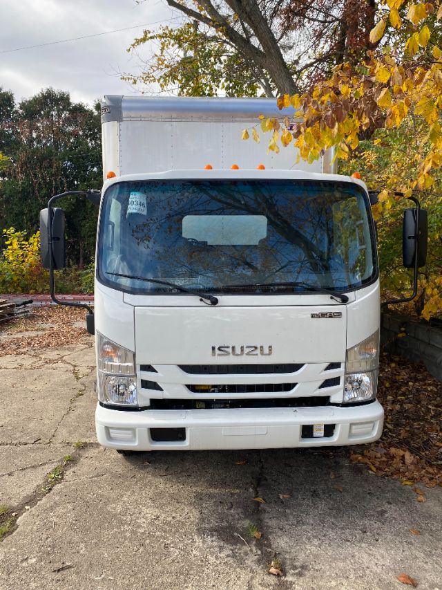 Isuzu NNR gas cab chassis truck front view showing Isuzu emblem, headlights, and grille.