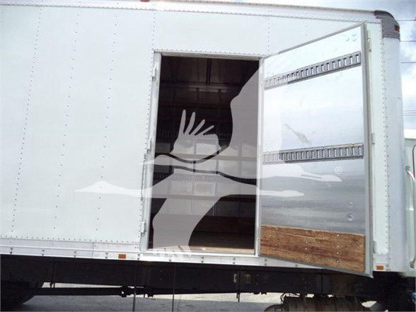 Truck box side with open rear entry door showing empty cargo area.