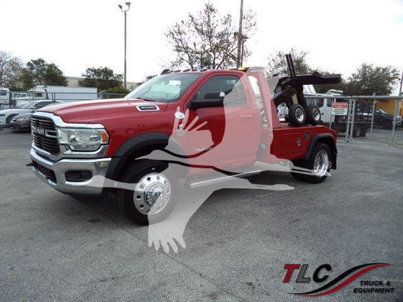 2021 Ram 4500 SLT tow truck in a dealership lot with red cab and bed, flatbed equipment visible behind cab, TLC Truck & Equipment watermark.