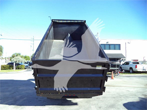 Isuzu NRR dump truck rear with open cargo bed showing plain metal interior and black exterior.