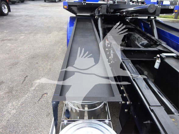Peterbilt 337 truck chassis showing frame, hydraulic lines, and toolbox area with a metal step.
