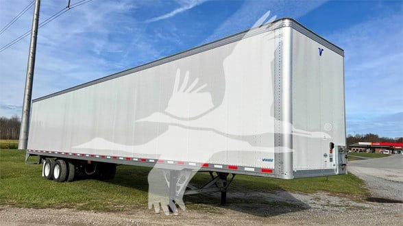 2020 Vanguard VXP trailer side and front showing white exterior with Vanguard logo and dual axles.