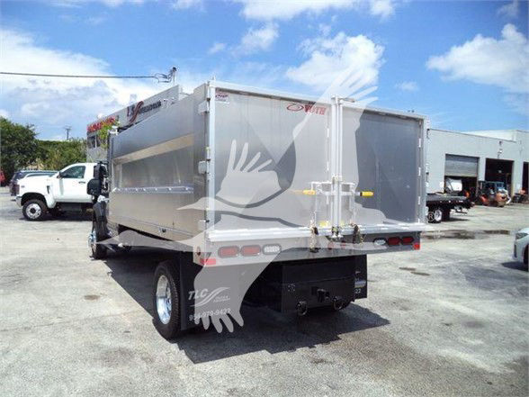 Ford F-550 dump truck rear and side view showing aluminum dump bed and taillights.