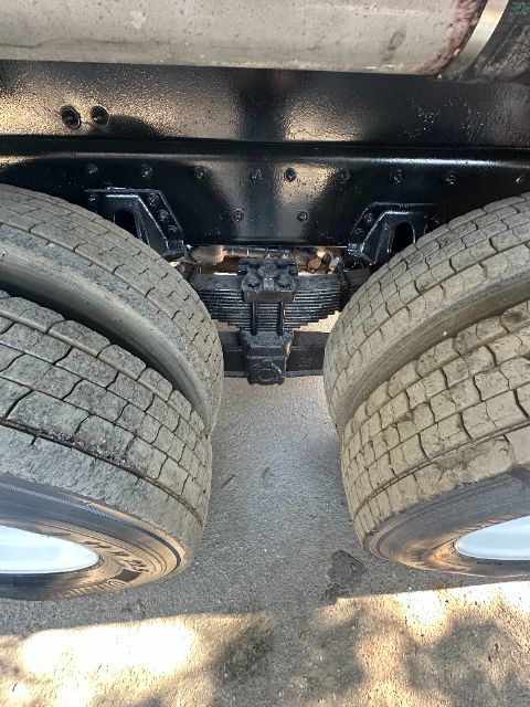 Sterling L8500 truck chassis showing dual rear axles and leaf springs.