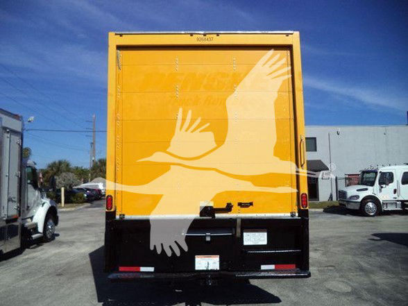 Back view of a 2019 International DURASTAR 4300 box truck with bright yellow rear doors featuring a large white bird graphic.