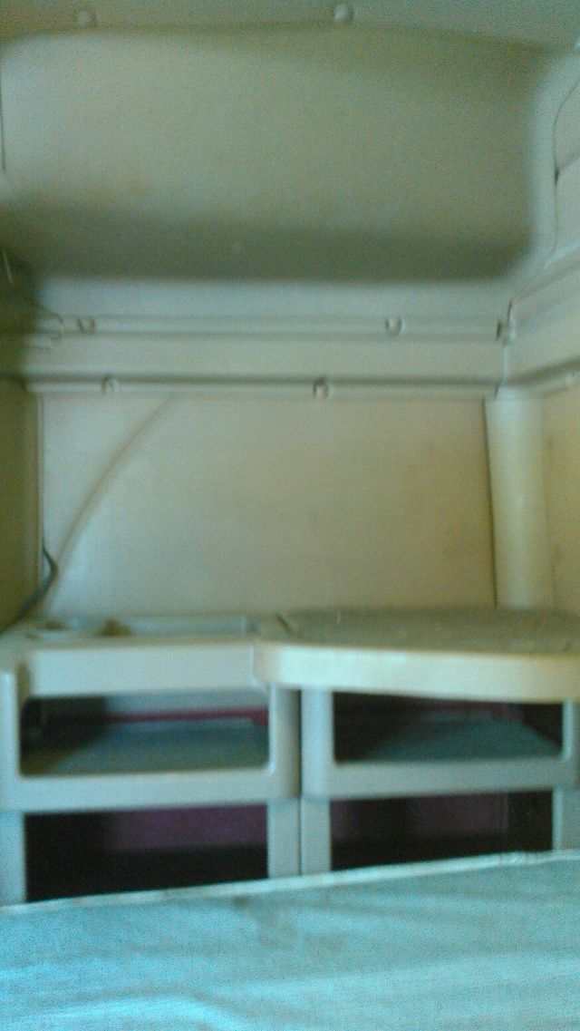 Interior sleeper cab area of a 2007 International 9900i showing bunk storage compartments and side walls.