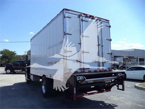 Rear of a refrigerated box truck with double rear doors and black undercarriage. Overlayed logo watermark.