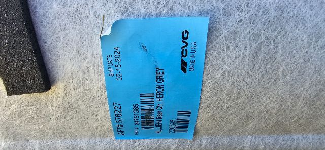 Blue label attached to metal surface showing part details with bar code and numbers. Text visible includes APPT 76627? SHIP DATE 02-15-2024, P/N 847? 530? and UUG MADE IN USA? TRENT?