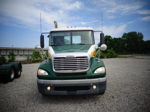 Freightliner Columbia 2009 conventional daycab truck front view with green and white paint.