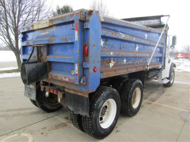 Dump truck bed of a 2005 Sterling LT8500 rear view showing dual rear wheels and star-spangled blue cargo box.