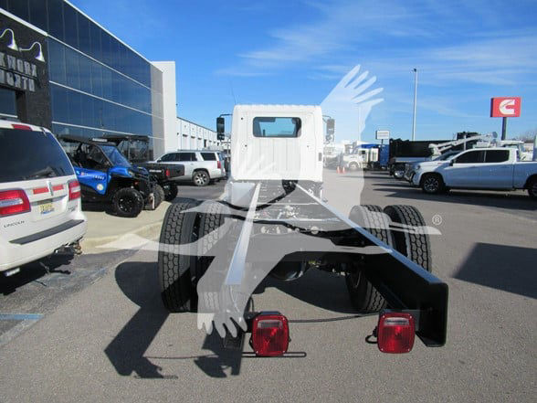 2026 Hino L6 cab and chassis rear view showing dual rear wheels, exposed chassis, and taillights.