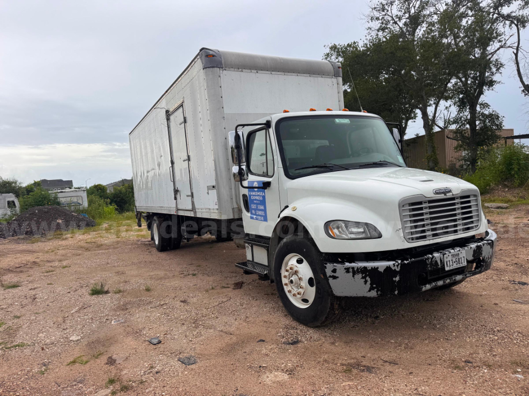 Freightliner M2 106 box truck showing front grille, cab, and large aluminum cargo box.