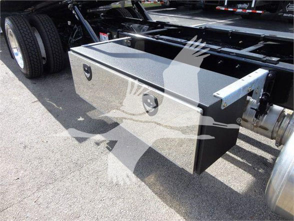 Peterbilt 337 truck chassis with a rectangular underbody storage box mounted near the rear wheel area.