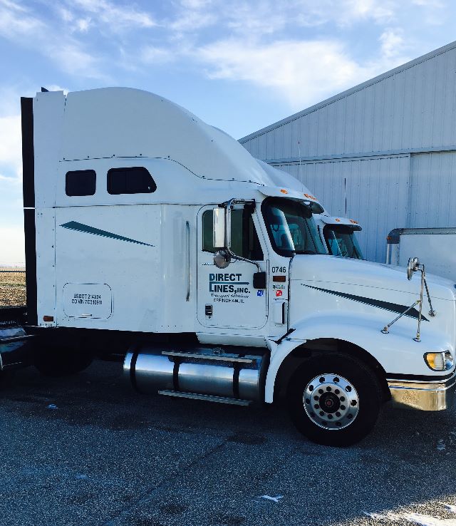 White 2007 International 9400I conventional sleeper tractor profile with Direct Lines, Inc. branding on door, chrome fuel tanks, and sleeper cab. Clear sky and industrial building in background.