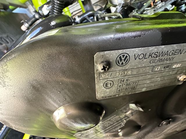 Ford/Volkswagen engine valve cover with metal plate showing model and certification