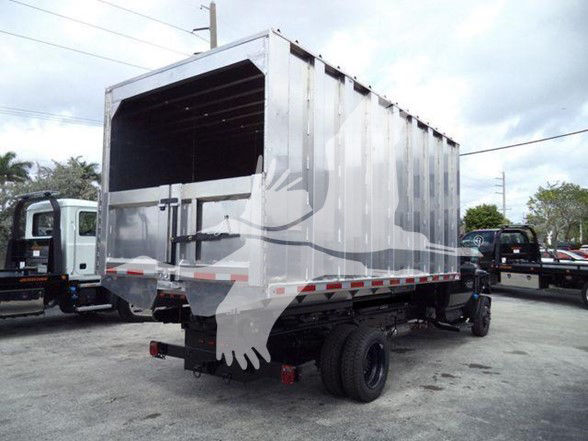 Truck bed shown from rear-right side of a 2023 Chevrolet Silverado 6500HD with dump body mounted on chassis.