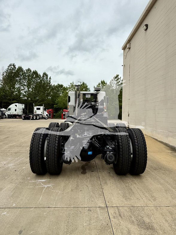 Kenworth L770 cab and chassis rear view showing dual rear axles and suspension components