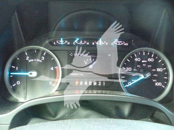 Dash view of 2017 Ford F450 instrument cluster with tachometer, speedometer, gear indicator PRNDM2, and DEF gauge.