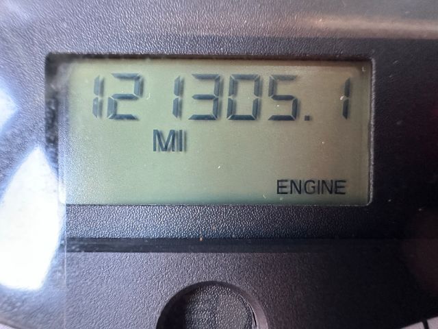 Dashboard odometer reading showing 121305.1 miles with ENGINE indicator on display.