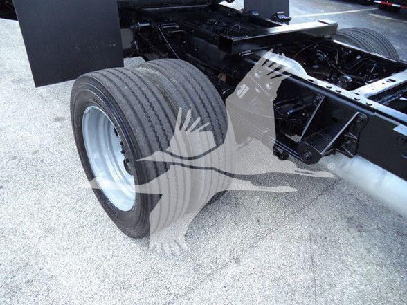 Ford F-550 chassis showing rear dual rear wheel and frame, with drivetrain components visible.