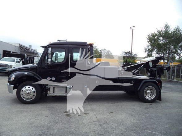 Freightliner BUSINESS CLASS M2 106 tow truck side view with black cab and flatbed chassis.