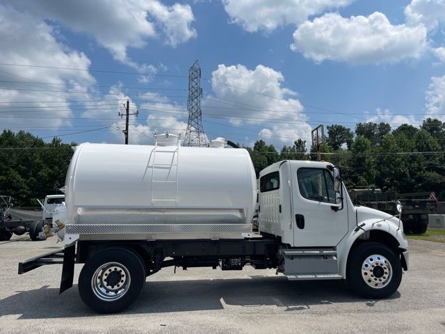 2013 Freightliner M2 sewer rodder septic truck with white tank, side view showing cab and cylindrical tank on chassis