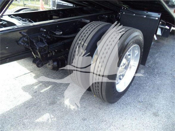 Rear dual rear wheel truck axle with black chassis and dual tires.