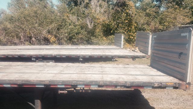 Great Dane 53x102 flatbed trailer showing rear loading area and deck with metal side rails.
