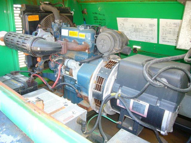 Terex AL4060D1-S-4MH trucker equipment engine bay showing diesel engine, alternator, air intake, and wiring harness with labels and a green background panel.