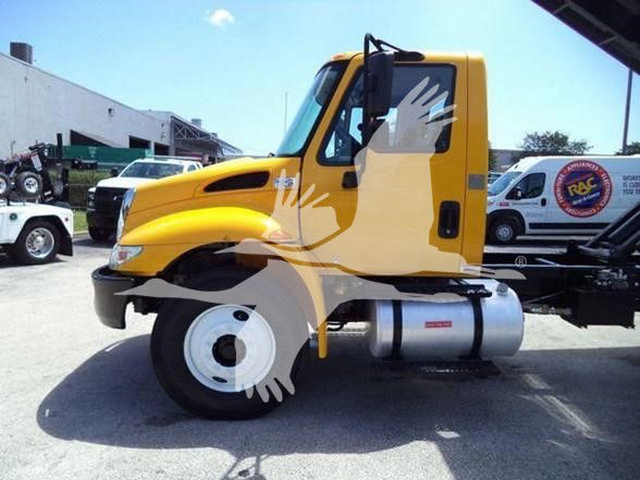 Yellow International DURASTAR 4300 cab chassis truck side profile with large fuel tank on the frame and single front wheel visible.