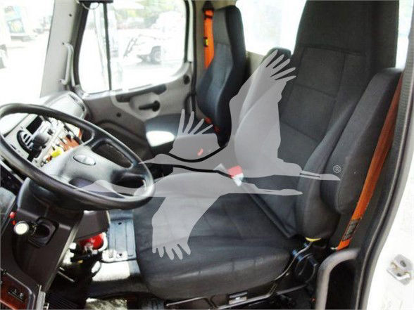 Tractor cab interior of a Freightliner M2 106 with steering wheel, driver seat, and dashboard visible; watermark overlay of birds covers center.