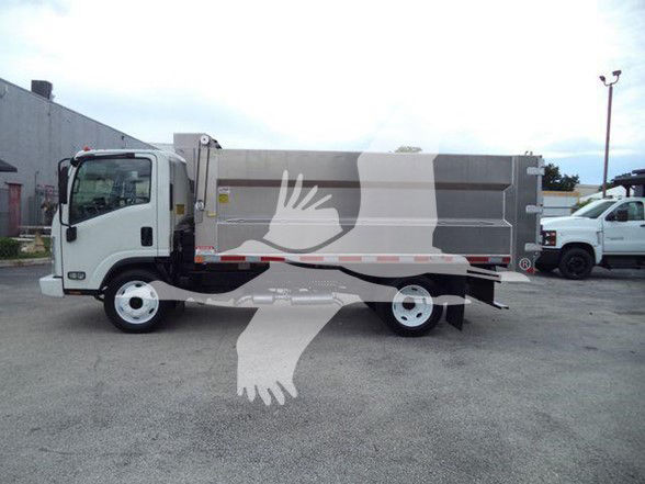 2017 Chevrolet W4500 dump truck side view with metal dump bed and white cab.