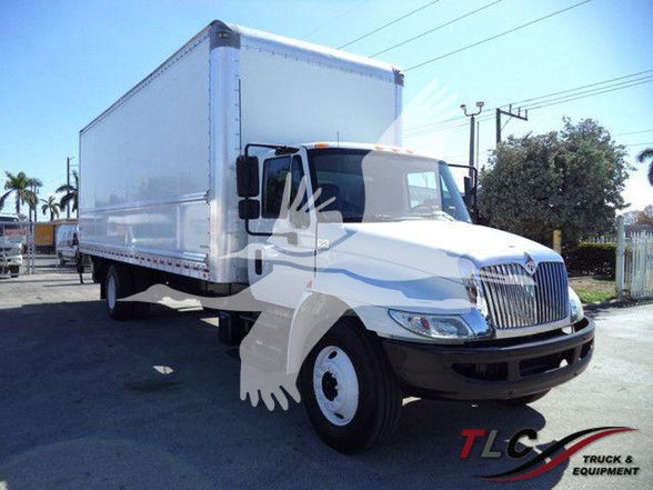 Box truck with white cab and large white box, International grille. TLC Truck & Equipment watermark. No legible technical labels visible.