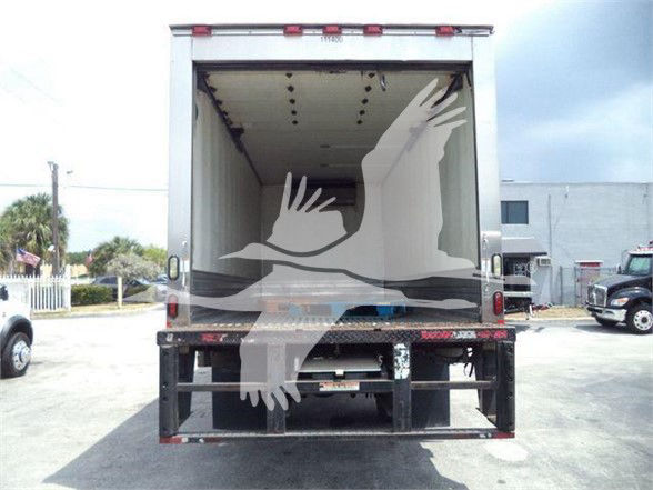Truck trailer rear view showing empty cargo space with rear bumper and taillights visible.