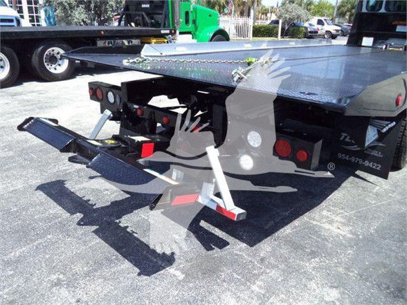 Trailer bed of a 2024 Kenworth T280 tow truck showing rear hitch assembly and platform.