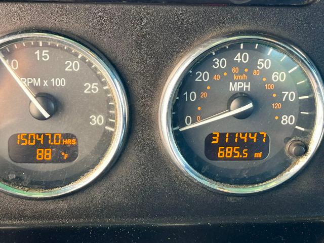 Peterbilt truck instrument cluster showing tachometer, speedometer, engine hours 15047.0 hrs, temperature 88 F, trip miles 685.5 mi, speed 0 mph.