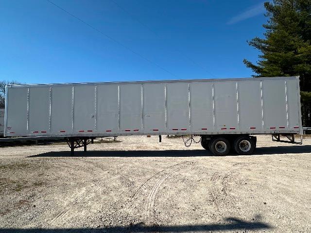 Trailer side view of a 2015 Wabash DuraPlate dry van with standard dual rear axles and white exterior.