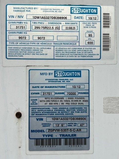 Trailer ID plate on Stoughton dry van showing GVWR 31751 lbs, GAWR 9072 kg (20000 lb), tire size 295/75R22.5, model ZGPV-535T-S-C-AR, date 10/12, VIN 1DW1A5327DB398906.