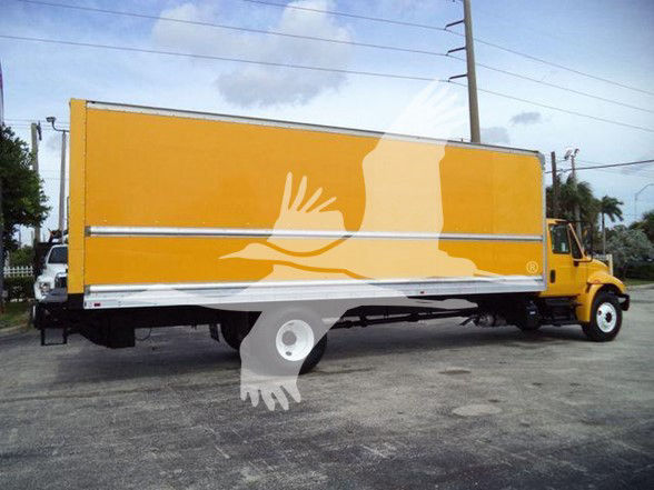 2018 International DURASTAR 4300 box truck with yellow cargo body and white undercarriage, side view showing the box; no legible small text visible on the truck side.