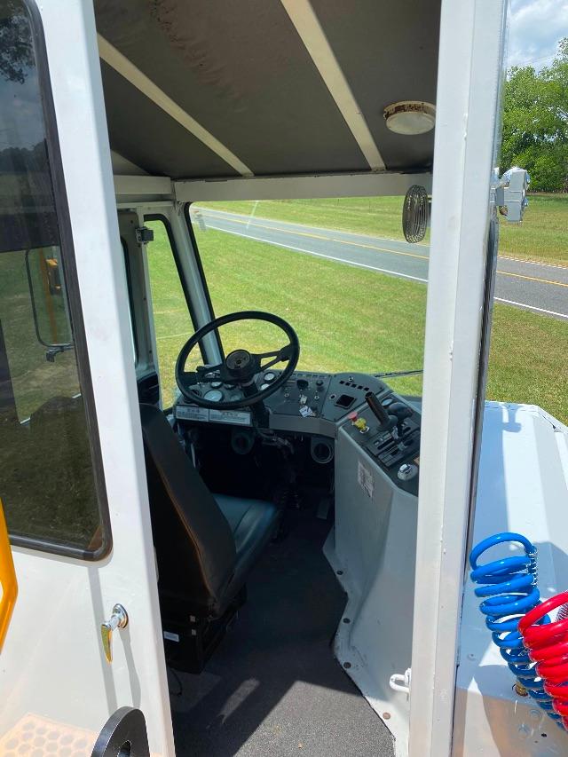Operator cab interior of a 2012 Ottawa YT 30 yard truck with steering wheel and dashboard visible.