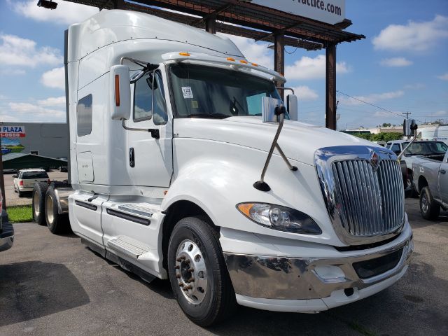 International PROSTAR truck front view showing chrome grille, large headlights, and aerodynamic sleeper cab.
