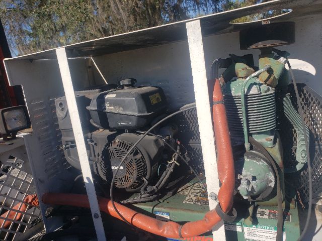 Equipment-driven platform with a gas-powered generator and a water pump mounted in a metal frame; visible labels and hoses.