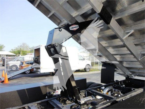 Ford F600 dump bed with Venco hydraulic component and chassis, showing hydraulic arm and dump mechanism.