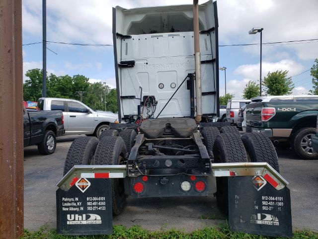 International ProStar rear view showing fifth wheel area, dual rear axles, and mudflaps with Uline logos. License plate area not visible.