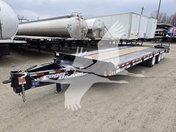 Eager Beaver 20 Xpt flatbed trailer showing gooseneck hitch and long flat deck with dual tandem axles.